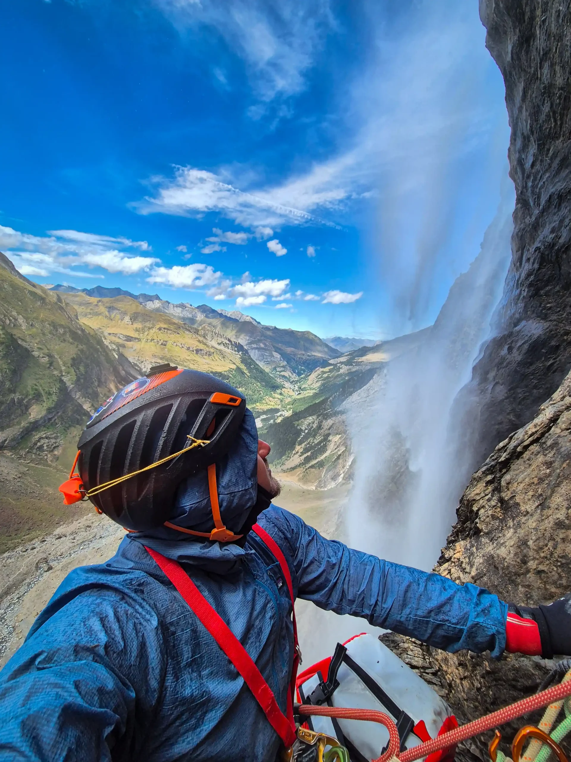 Jason Nunez rigging an anchor above a waterfall